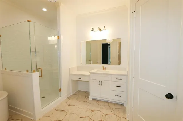 a spacious bathroom with a double vanity sink mirror and bathtub