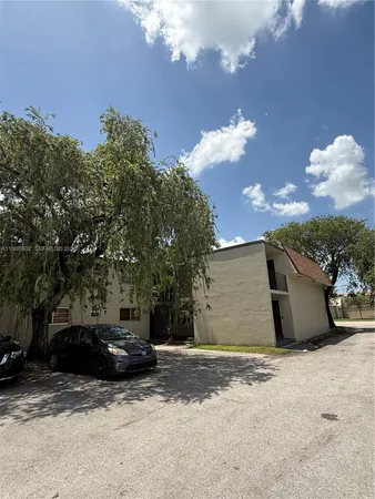a view of a car parked in front of a house