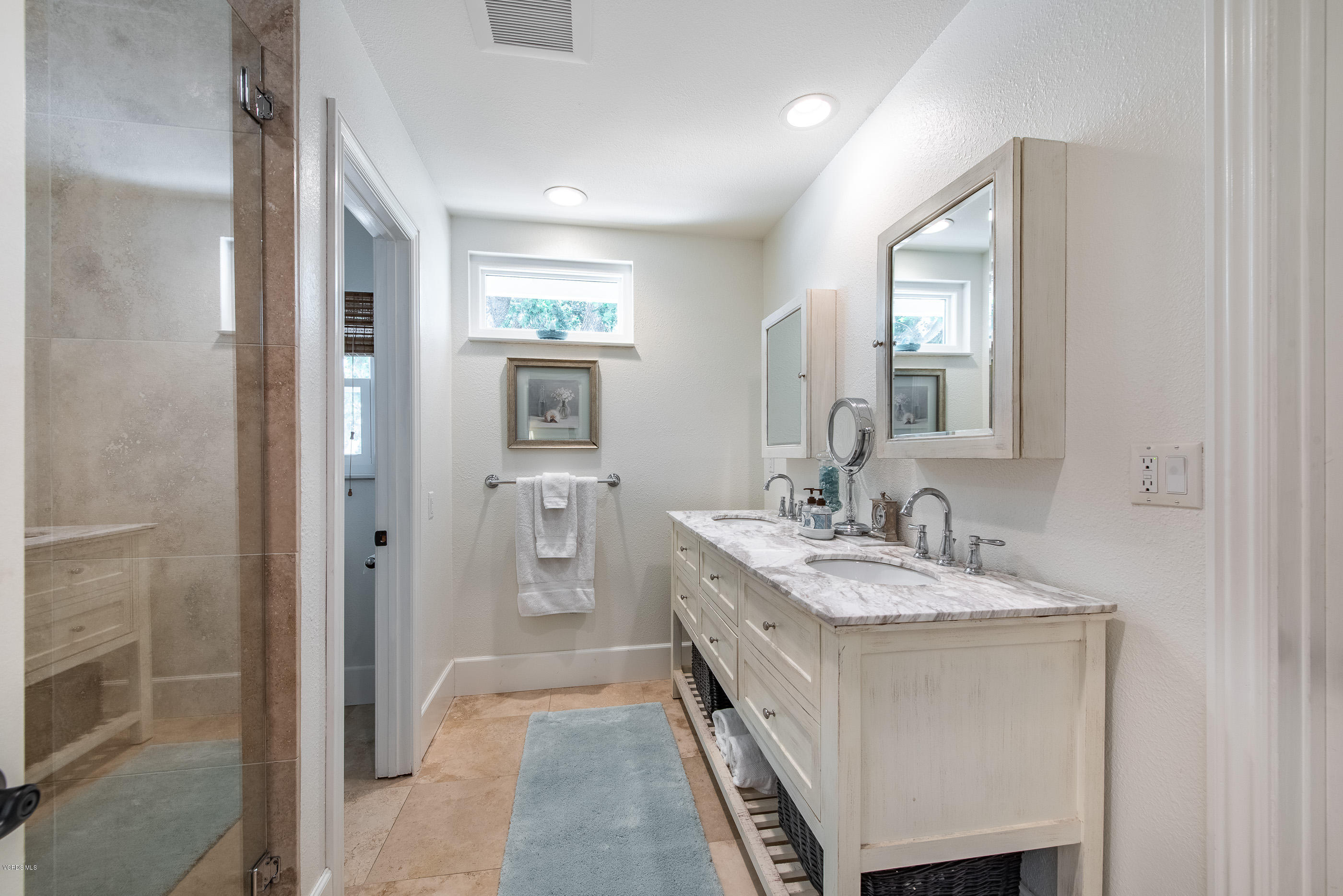 665 Azalea Street Thousand Oaks, CA 91360 - Photo 18 of 52 a en suite bathroom with a granite countertop sink and a mirror