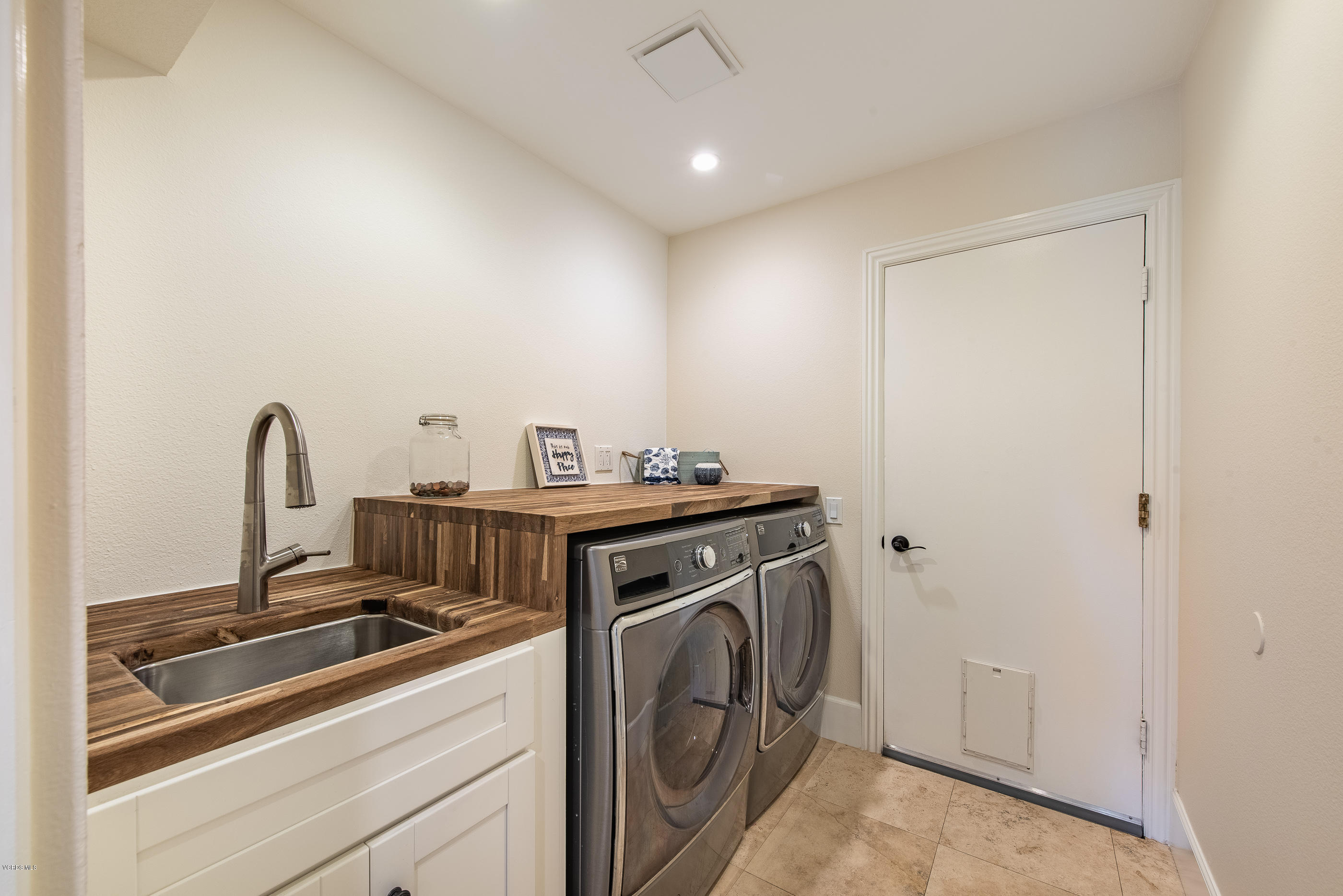 665 Azalea Street Thousand Oaks, CA 91360 - Photo 23 of 52 a view of a storage and utility room with washer and dryer