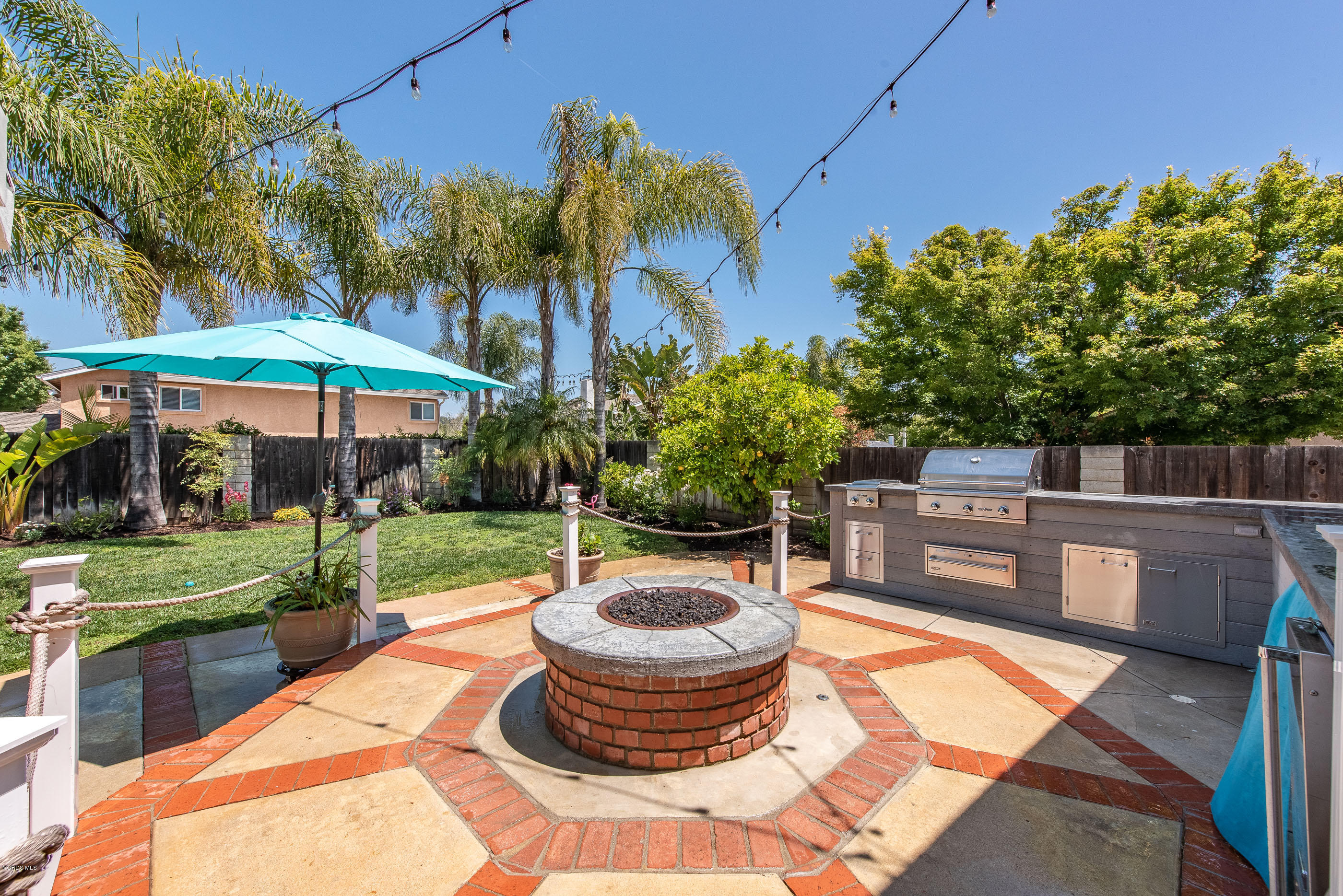 665 Azalea Street Thousand Oaks, CA 91360 - Photo 25 of 52 a view of a backyard with plants and a patio