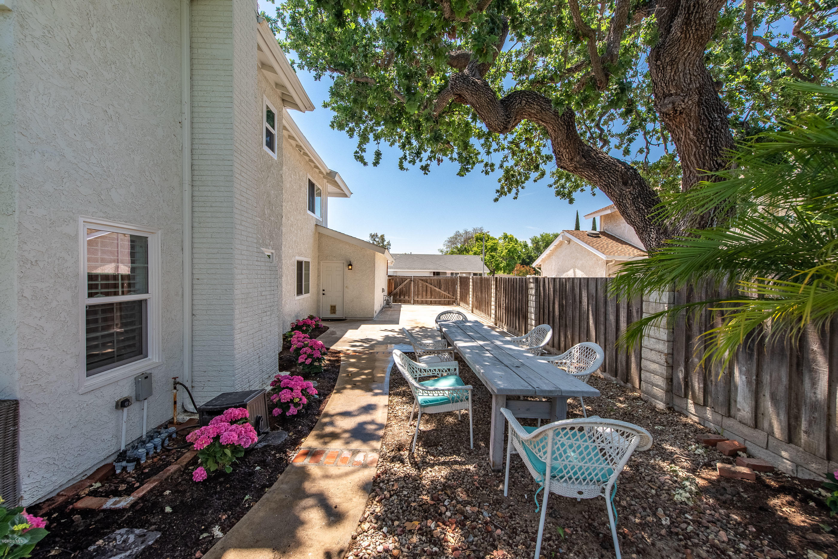 665 Azalea Street Thousand Oaks, CA 91360 - Photo 31 of 52 a view of a chair and table in backyard of the house