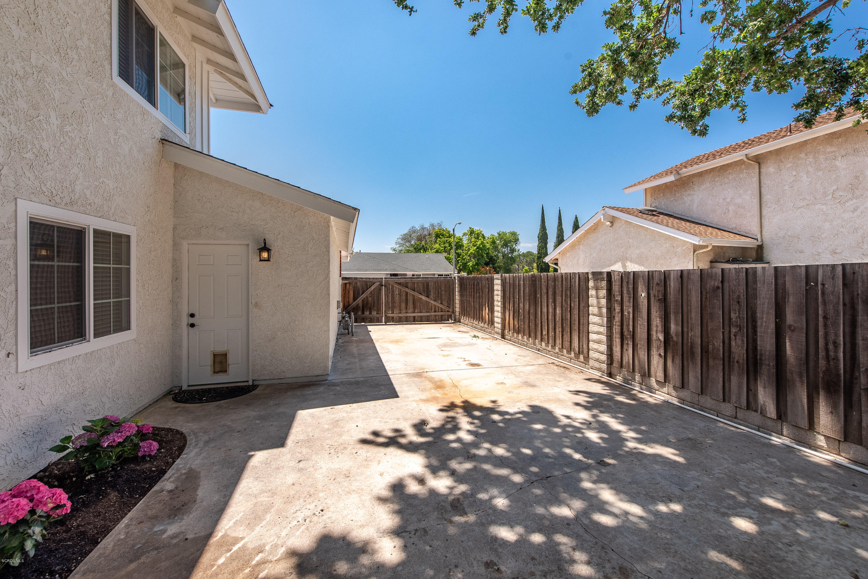 665 Azalea Street Thousand Oaks, CA 91360 - Photo 33 of 52 a view of a backyard with wooden fence