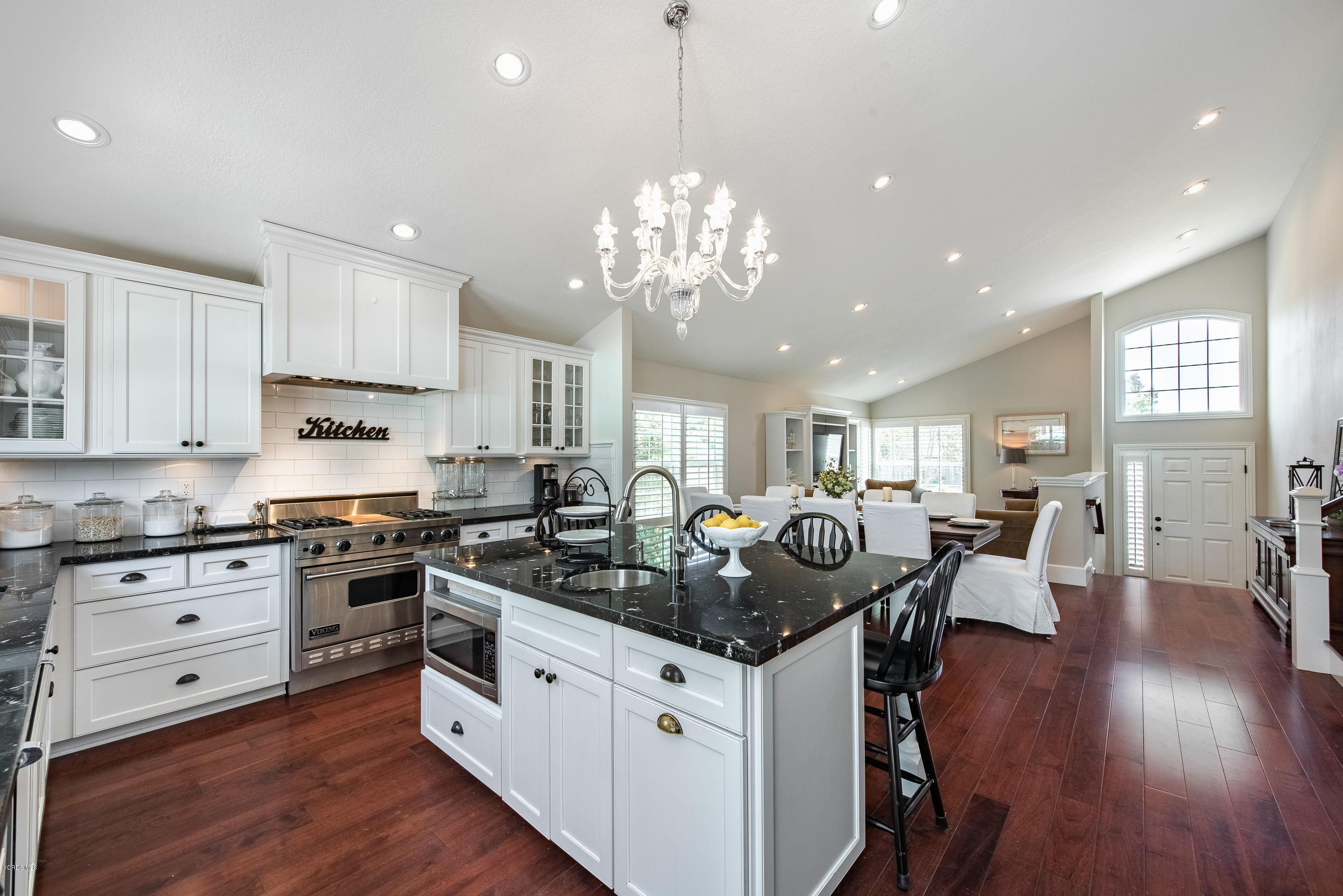 665 Azalea Street Thousand Oaks, CA 91360 - Photo 6 of 52 a kitchen with granite countertop a stove and white cabinets