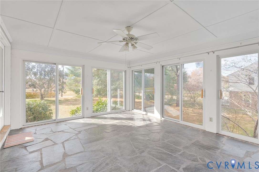 12216 Mt Hermon Road Ashland, VA 23005 - Photo 13 of 49 Unfurnished sunroom featuring stone floors and cei