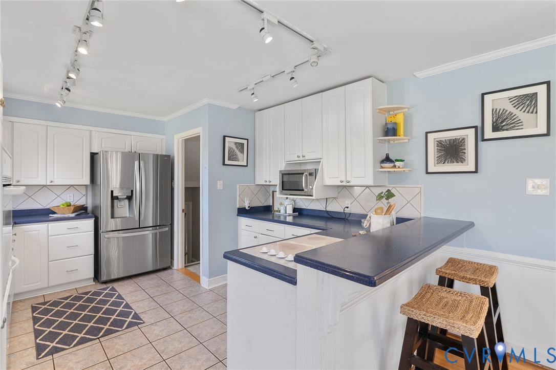 12216 Mt Hermon Road Ashland, VA 23005 - Photo 18 of 49 Kitchen with solid surface countertops, ceramic ti