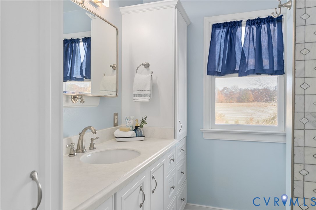 12216 Mt Hermon Road Ashland, VA 23005 - Photo 28 of 49 Remolded hall bath with marble countertop and exce