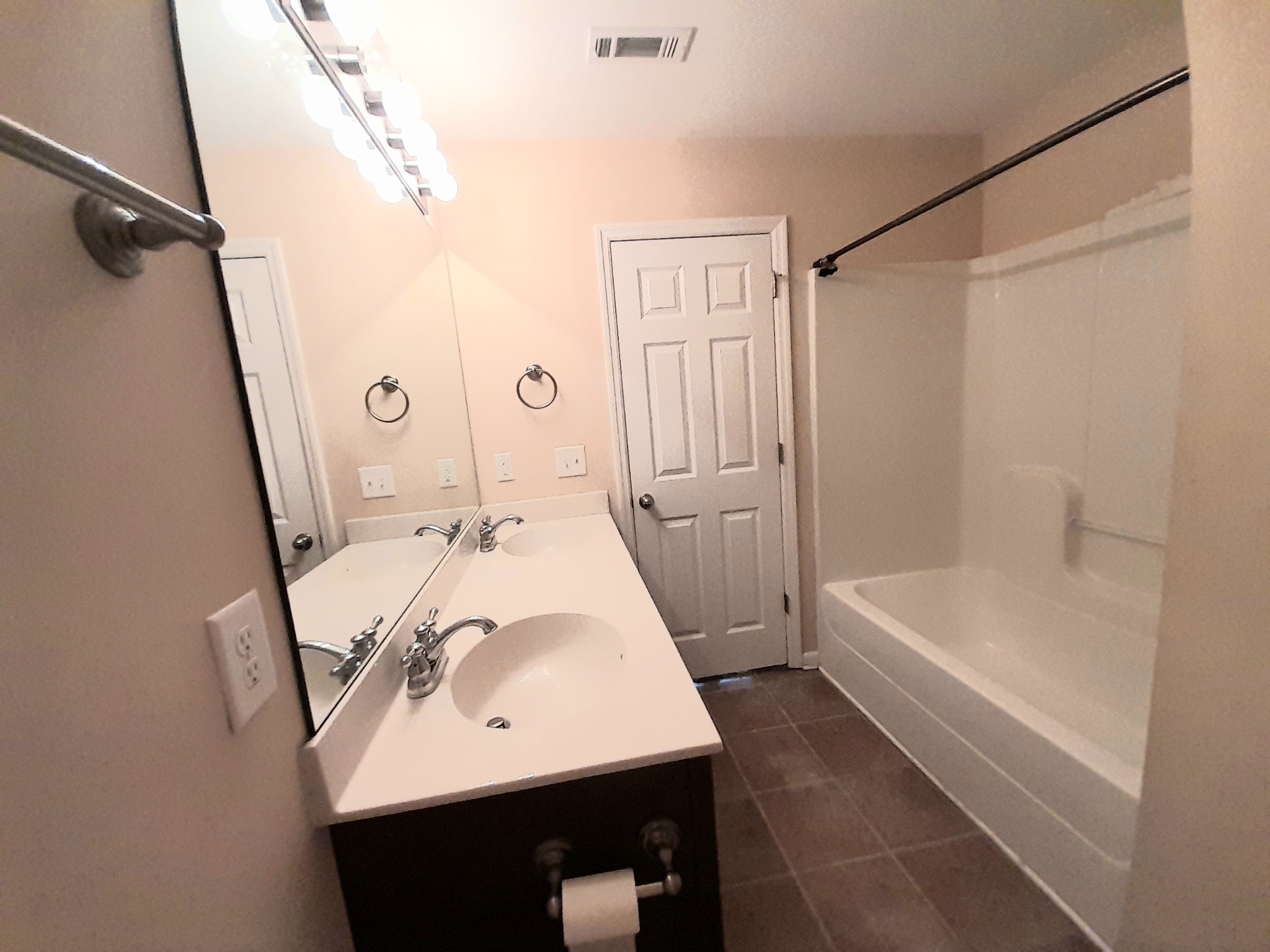 2021 Hemlock Drive Spring Hill, TN 37174 - Photo 13 of 14 a bathroom with a sink a mirror and a bathtub