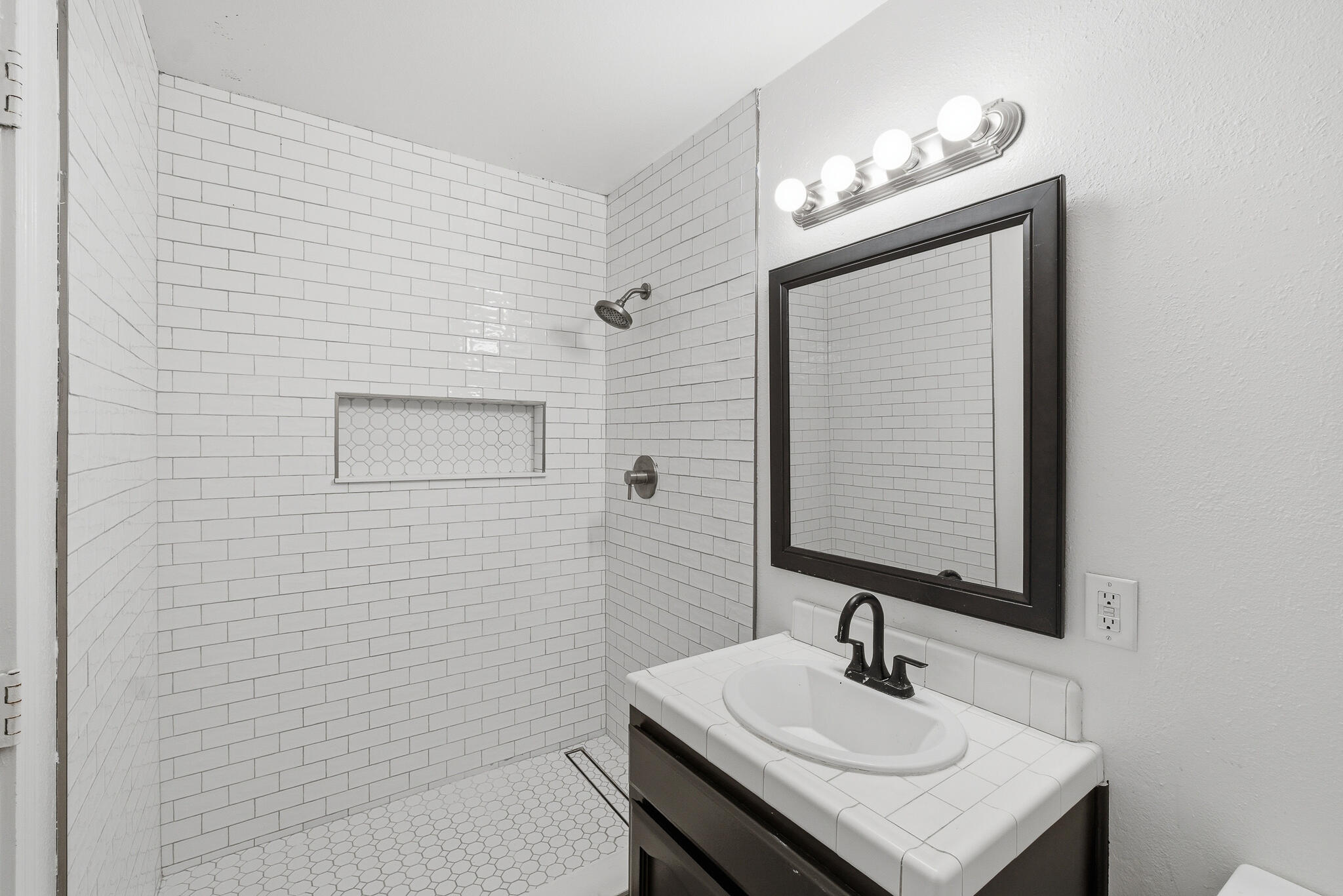 618 Birdsong Court Exeter, CA 93221 - Photo 29 of 62 a bathroom with a sink a light fixture and a mirror