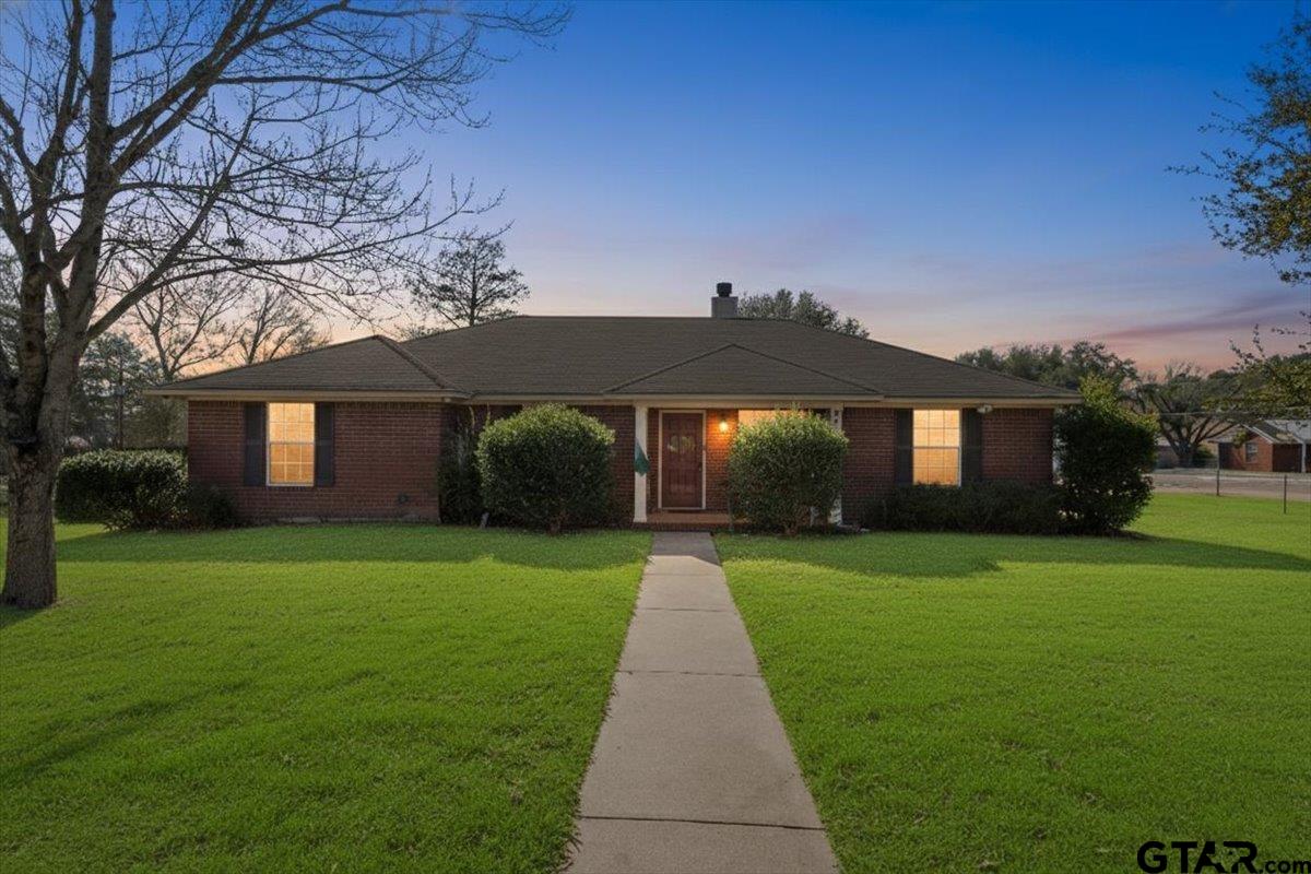 a front view of a house with yard
