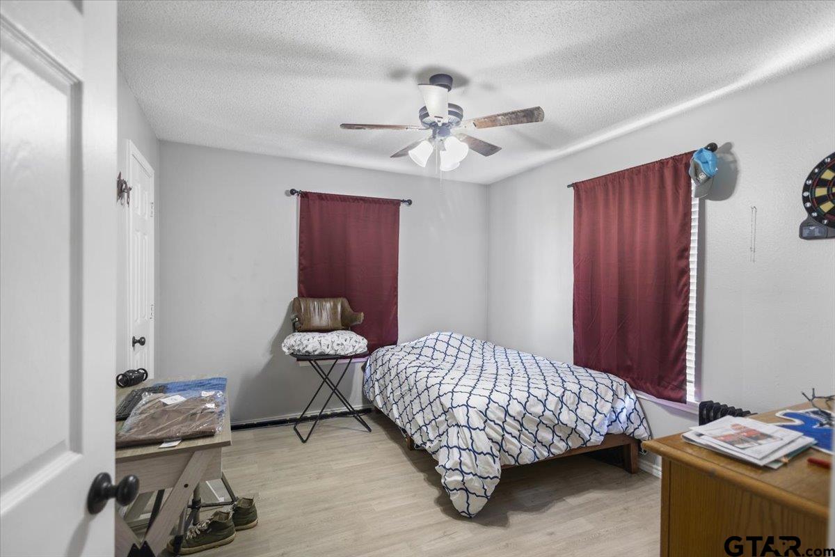 14716 Fox Ridge Tyler, TX 75709 - Photo 17 of 25 a bedroom with a bed and a window