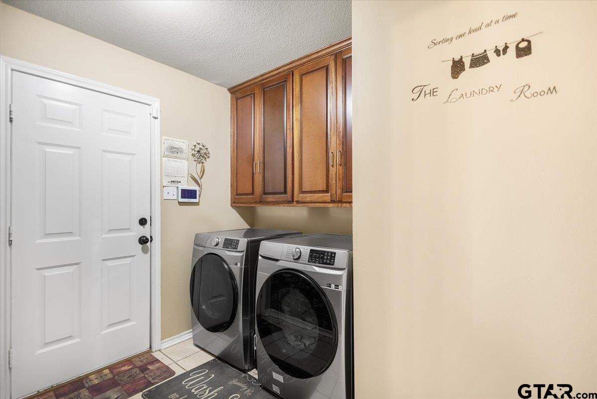 14716 Fox Ridge Tyler, TX 75709 - Photo 21 of 25 a utility room with dryer and washer