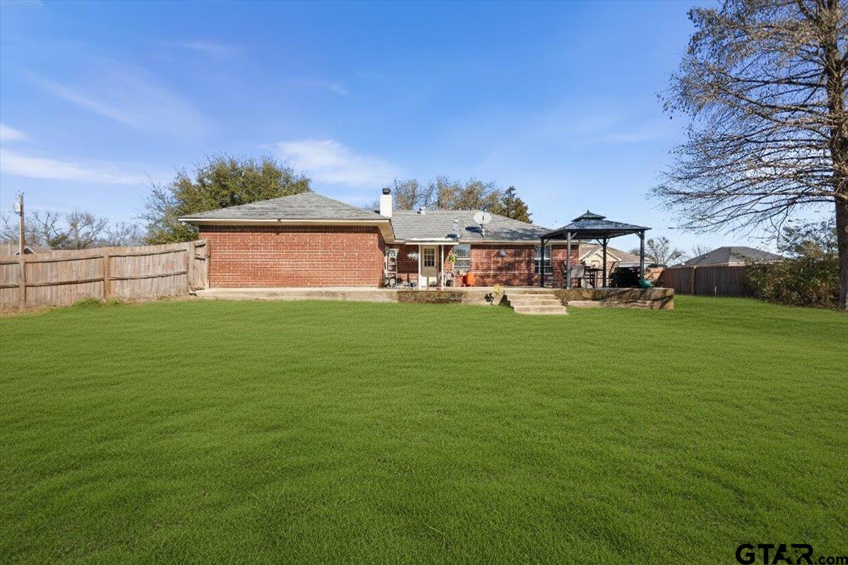 14716 Fox Ridge Tyler, TX 75709 - Photo 22 of 25 a view of a house with a big yard