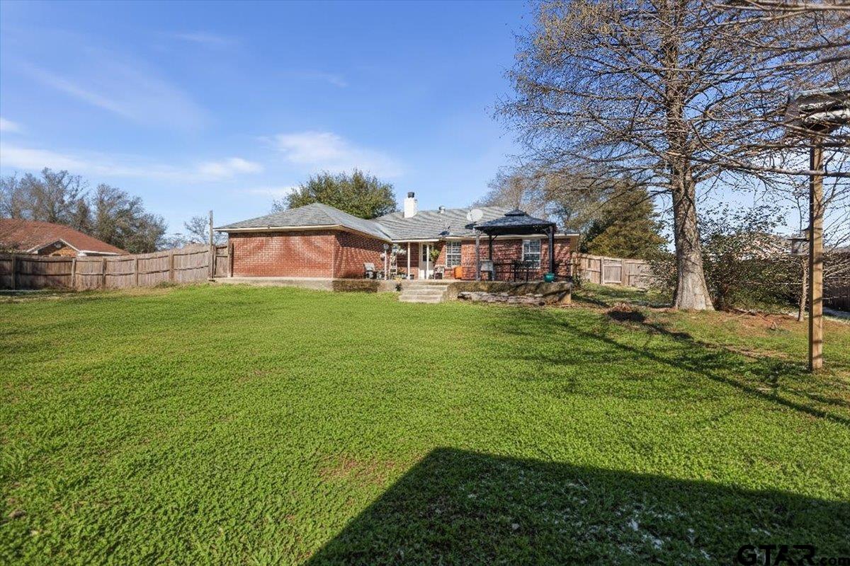 14716 Fox Ridge Tyler, TX 75709 - Photo 23 of 25 a view of a house with a big yard