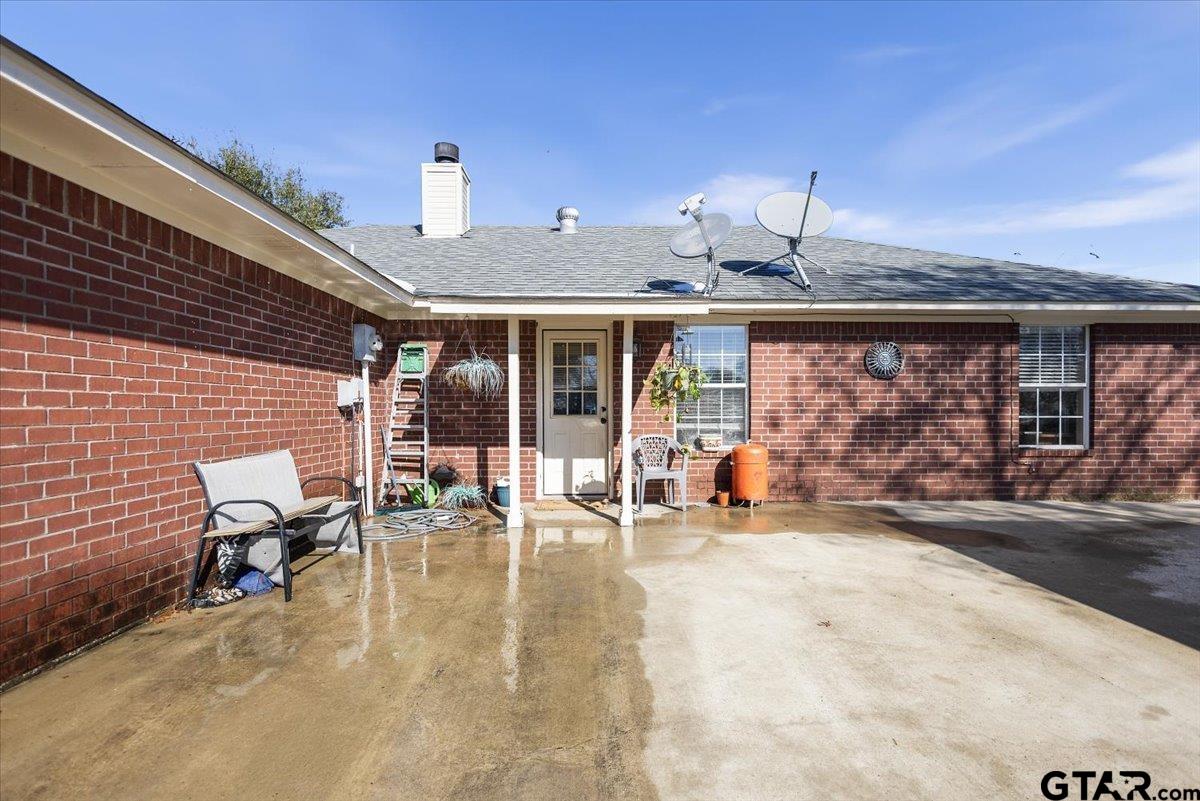 14716 Fox Ridge Tyler, TX 75709 - Photo 24 of 25 a view of a patio with table and chairs near a road