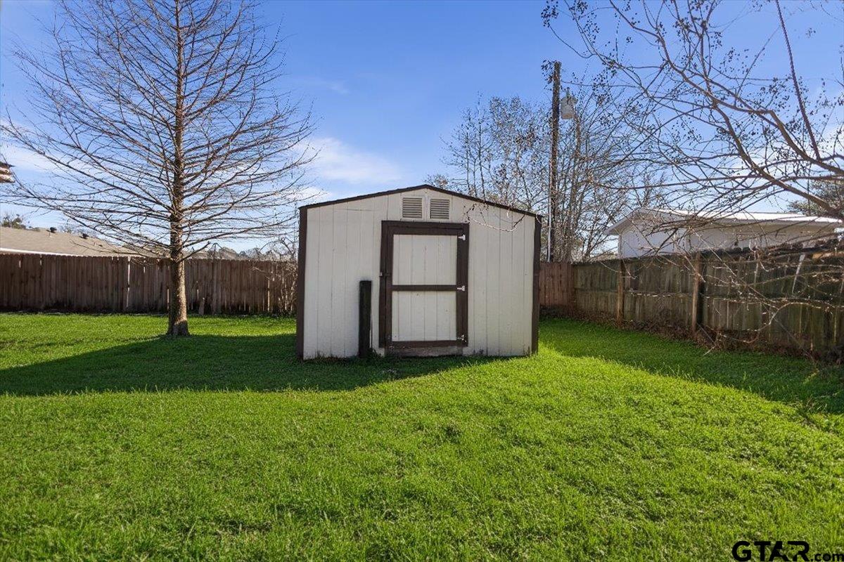 14716 Fox Ridge Tyler, TX 75709 - Photo 25 of 25 a front view of a house with garden