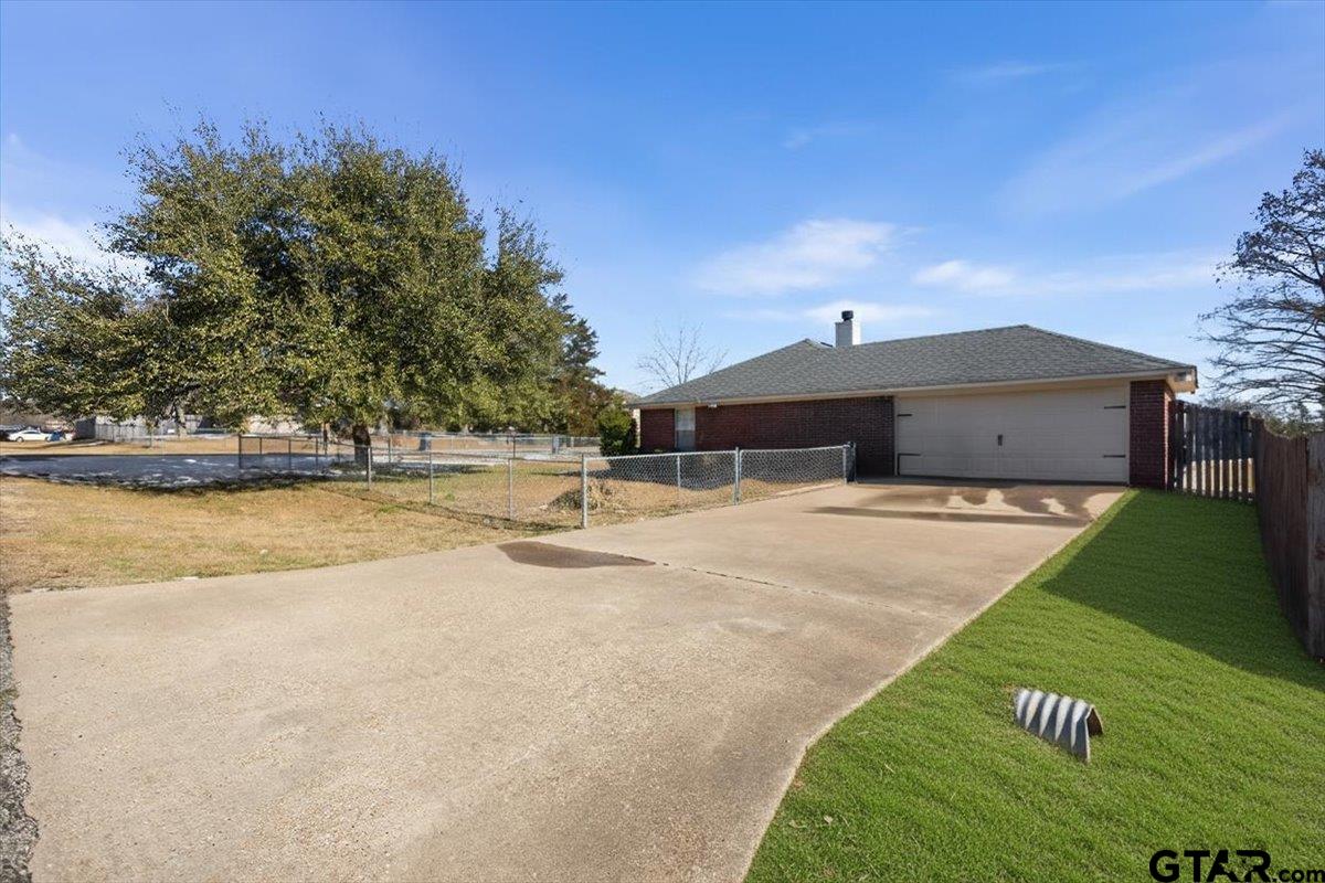 14716 Fox Ridge Tyler, TX 75709 - Photo 3 of 25 a view of a house with a yard
