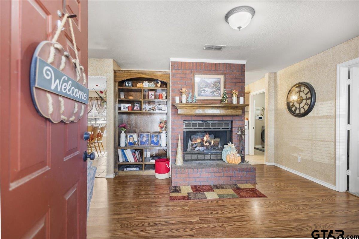 14716 Fox Ridge Tyler, TX 75709 - Photo 4 of 25 a living room with furniture and a fireplace