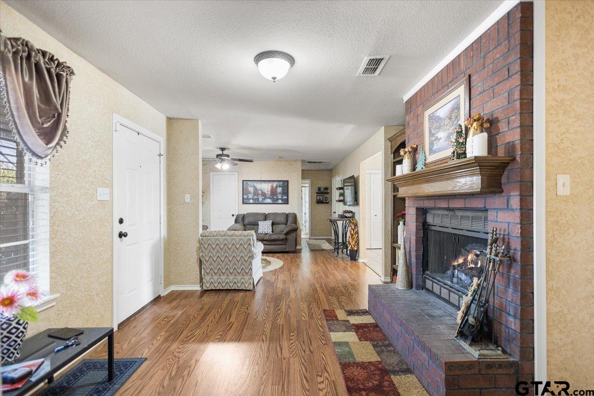 14716 Fox Ridge Tyler, TX 75709 - Photo 5 of 25 a living room with furniture and a fireplace