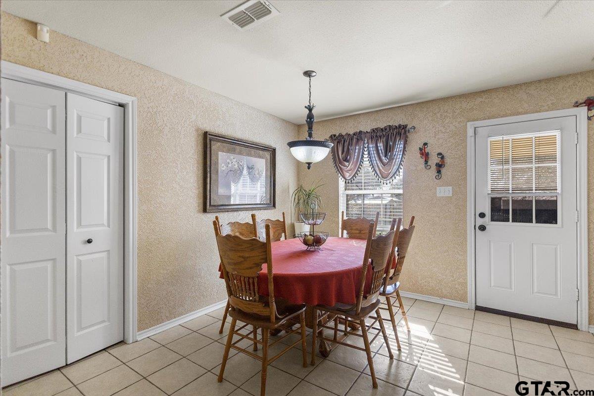 14716 Fox Ridge Tyler, TX 75709 - Photo 8 of 25 a view of a dining room with furniture