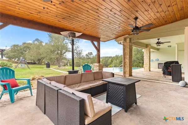 a view of yard with patio