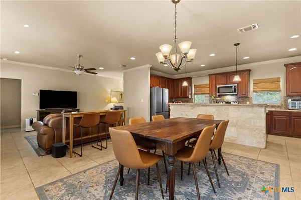 a view of a dining room with furniture