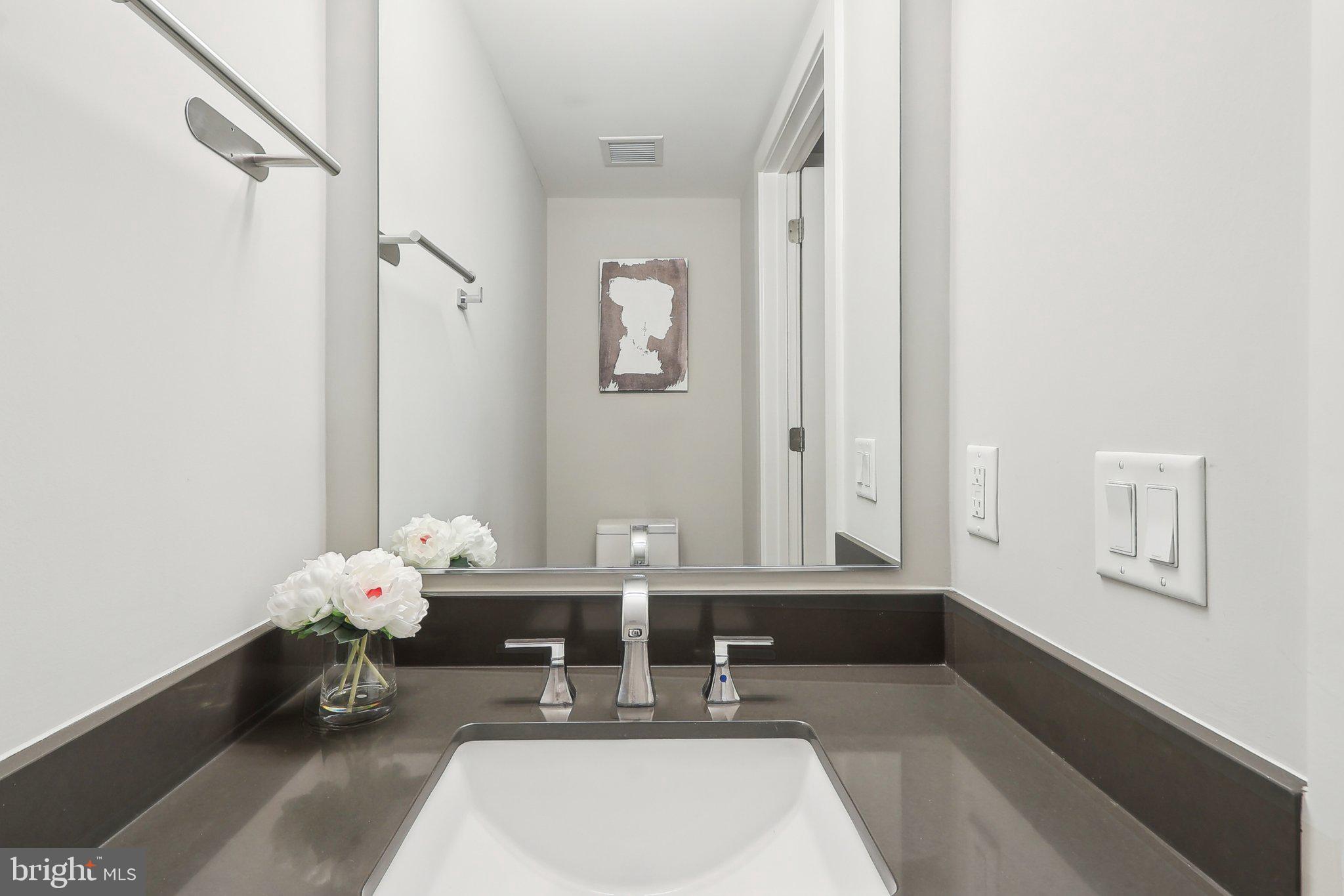 88 V Street Southwest, Unit 311 Washington, DC 20024 - Photo 14 of 32 a dining room with furniture and wooden floor