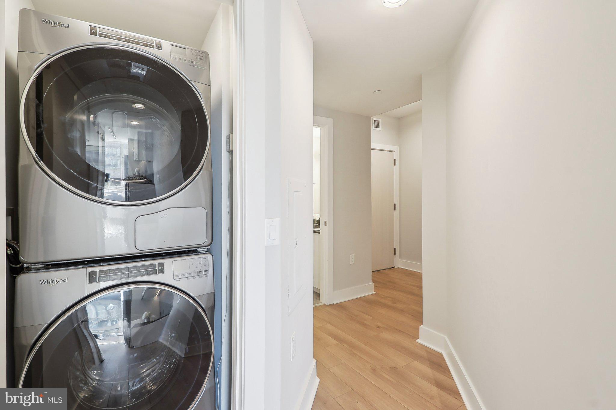 88 V Street Southwest, Unit 311 Washington, DC 20024 - Photo 16 of 32 a view of a hallway with washer and dryer