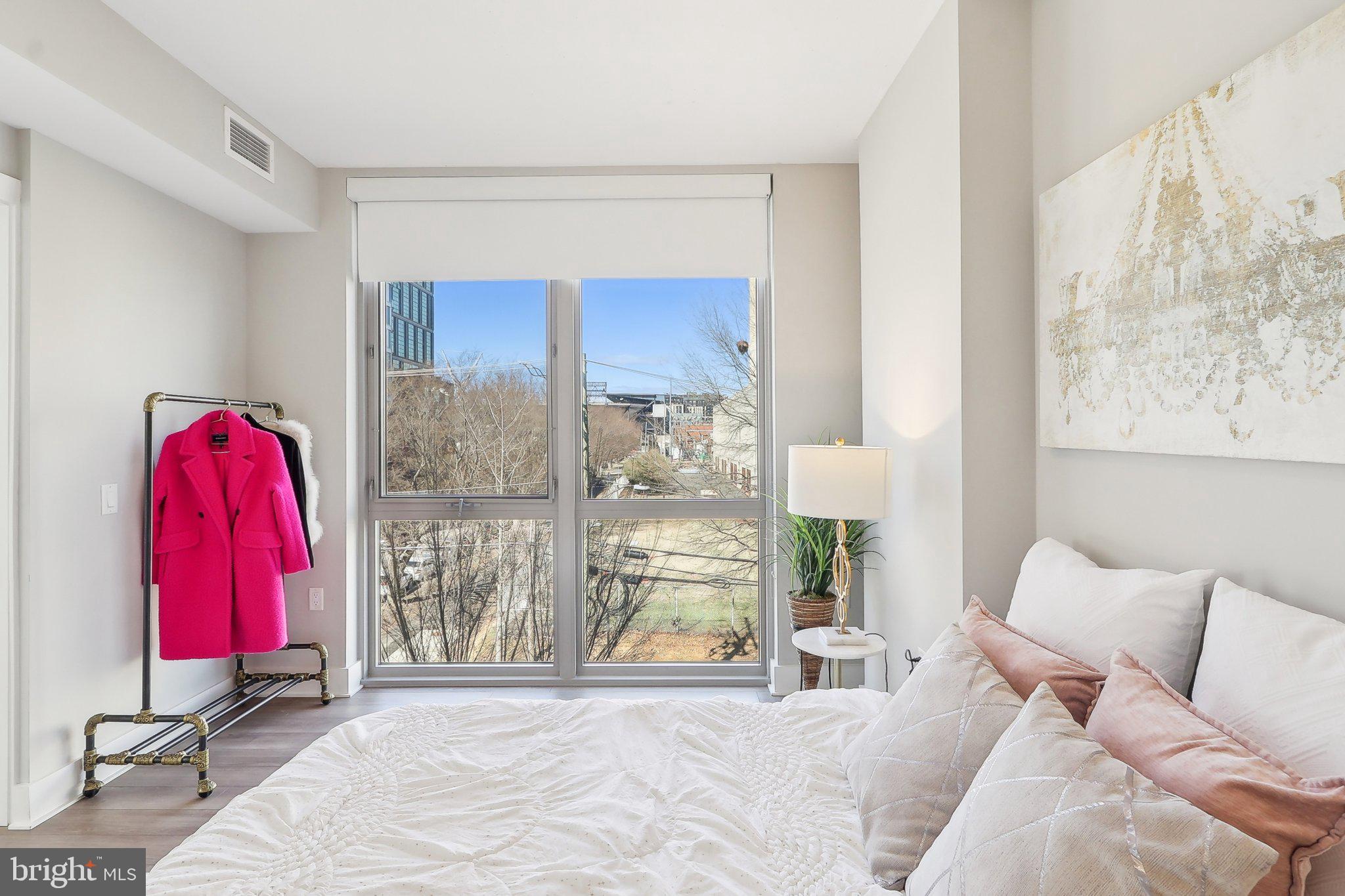 88 V Street Southwest, Unit 311 Washington, DC 20024 - Photo 20 of 32 a bedroom with a bed and a window