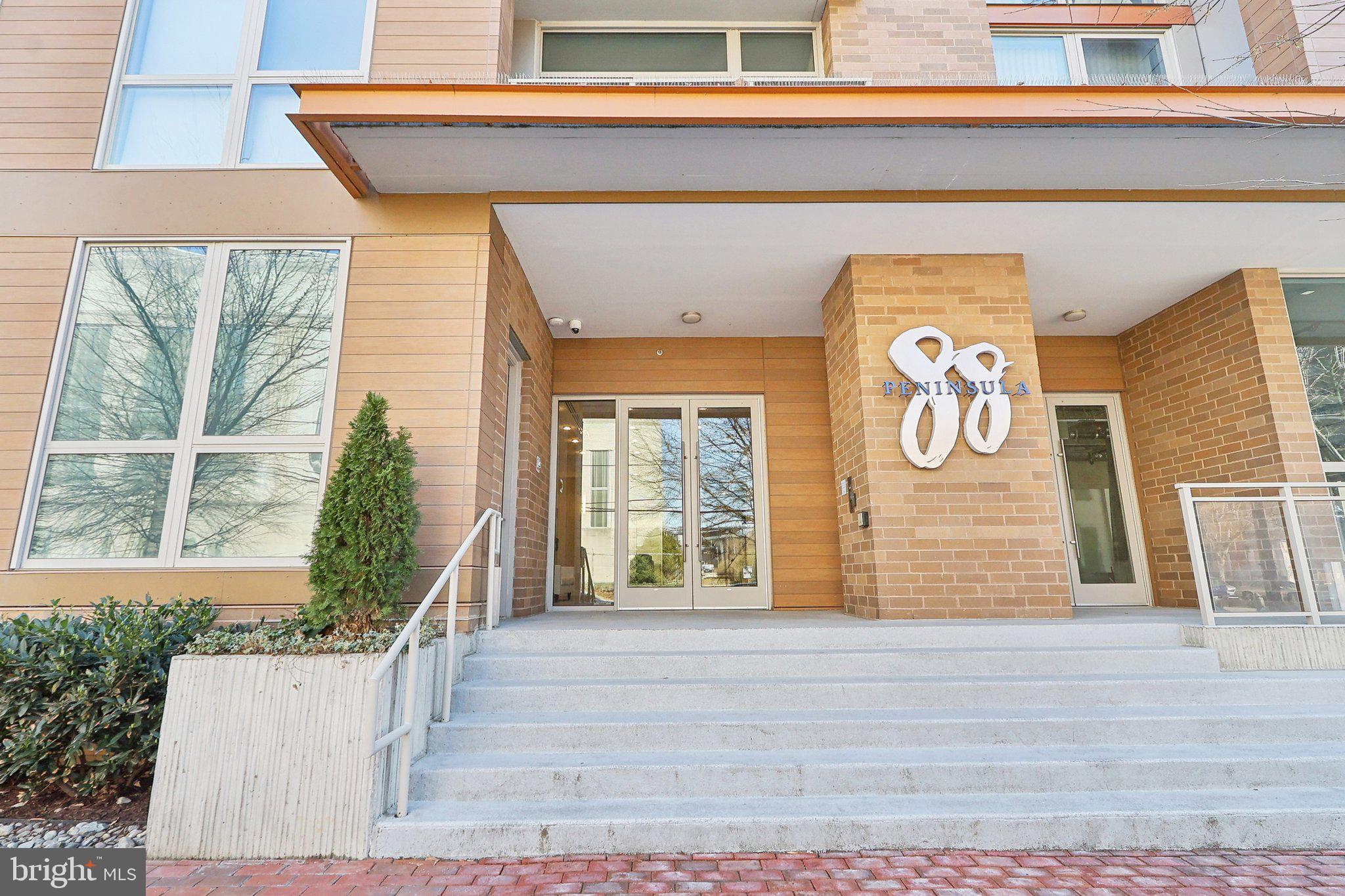 88 V Street Southwest, Unit 311 Washington, DC 20024 - Photo 26 of 32 a front view of a house with a garage