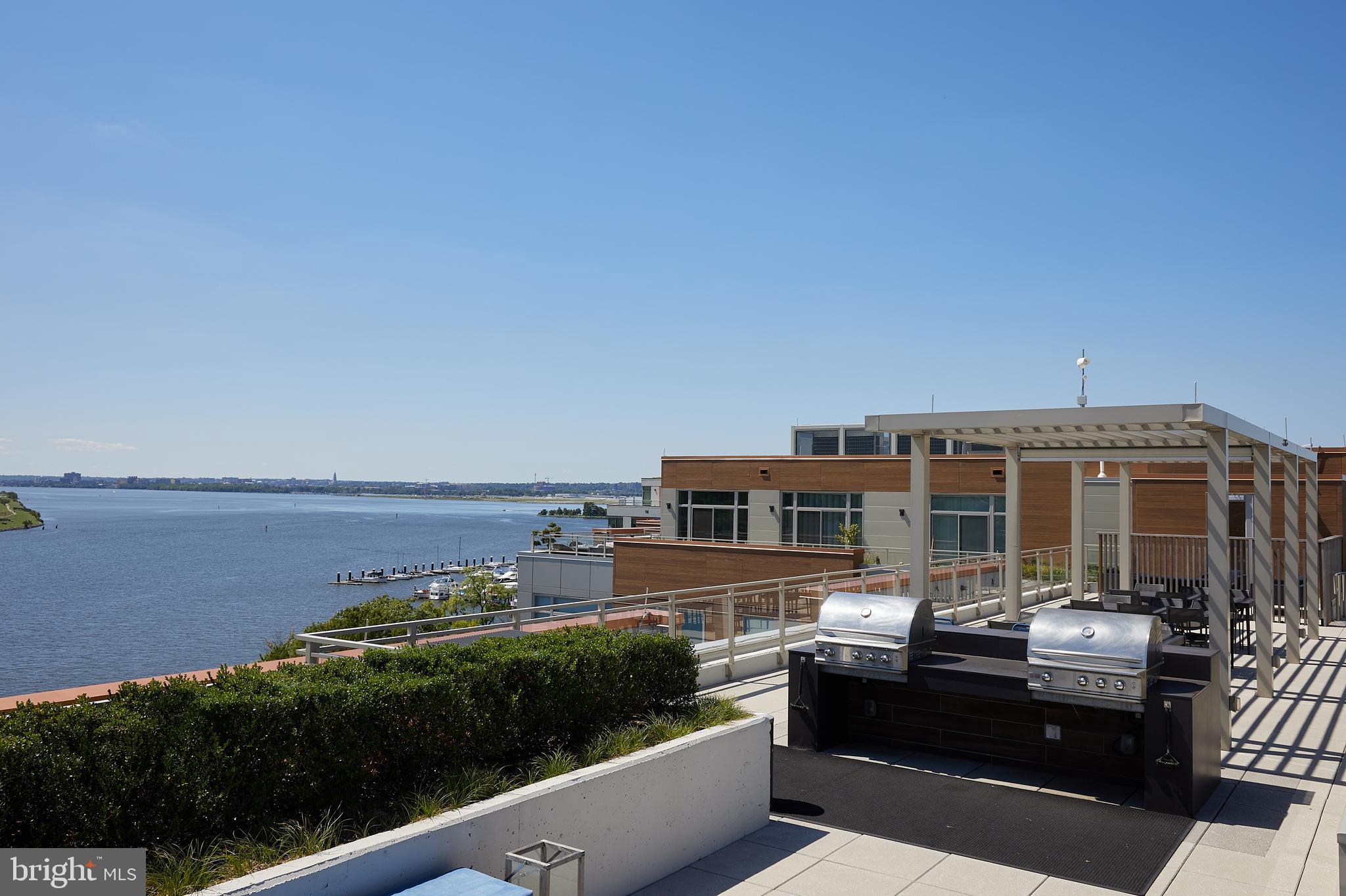 88 V Street Southwest, Unit 311 Washington, DC 20024 - Photo 30 of 32 a view of a lake with a building in the background