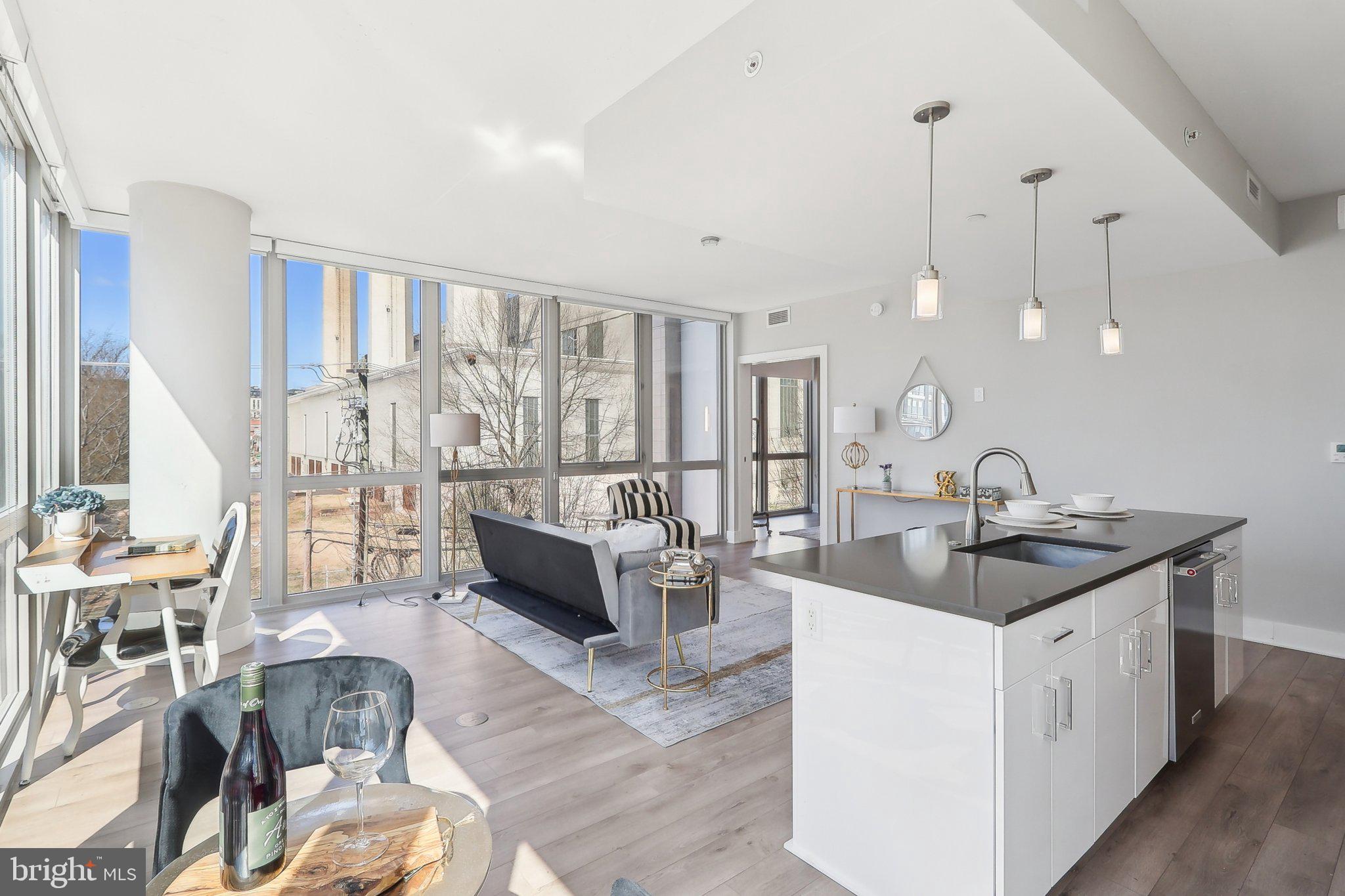 88 V Street Southwest, Unit 311 Washington, DC 20024 - Photo 5 of 32 a kitchen with sink and view of living room