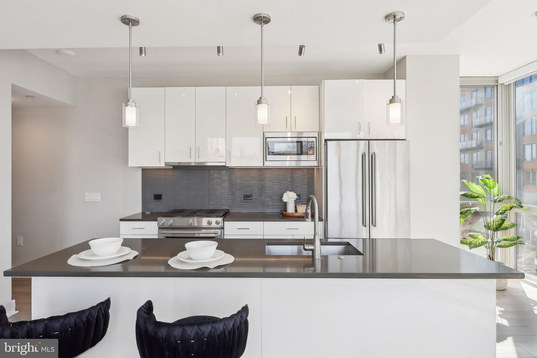 88 V Street Southwest, Unit 311 Washington, DC 20024 - Photo 8 of 32 a kitchen with a table and chairs