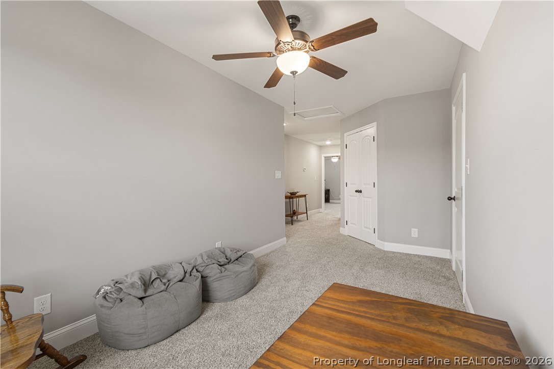 137 Minter School Road Sanford, NC 27332 - Photo 37 of 50 a spacious bedroom with a bed and ceiling fan