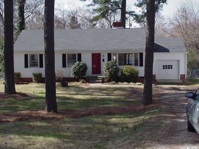 919 Brookside Drive Raleigh, NC 27604 - Photo 1 of 1 a front view of a house with garden