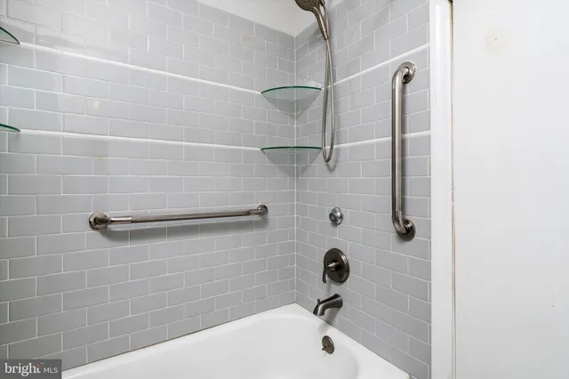 a bathroom with a shower and a bathtub