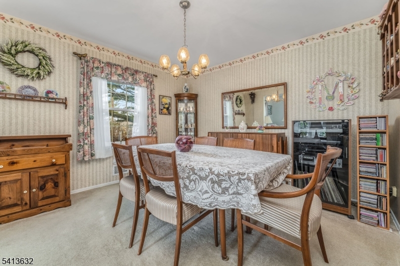 14 Ramsey Road Lebanon, NJ 08833 - Photo 14 of 47 a view of a dining room with furniture a chandelier and wooden floor