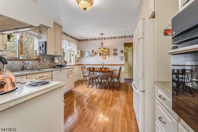 14 Ramsey Road Lebanon, NJ 08833 - Photo 16 of 47 a dining room with furniture and a kitchen view