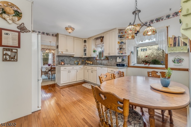 14 Ramsey Road Lebanon, NJ 08833 - Photo 19 of 47 a large kitchen with stainless steel appliances granite countertop a stove a sink dishwasher and a refrigerator with wooden floor