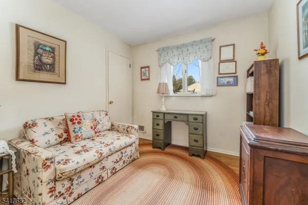a bedroom with a bed and a fireplace