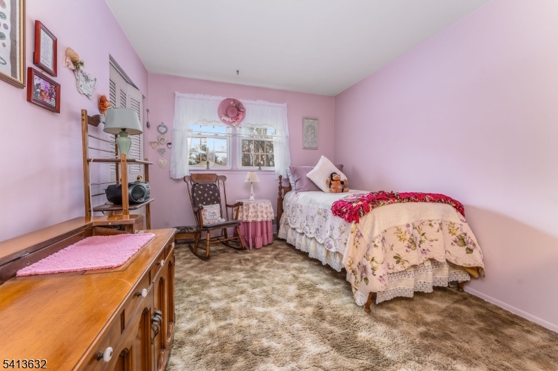 14 Ramsey Road Lebanon, NJ 08833 - Photo 35 of 47 a bed room with a bed and a chair