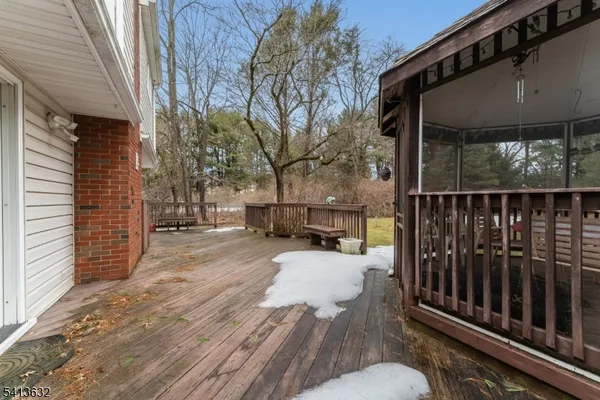 a view of backyard with a deck
