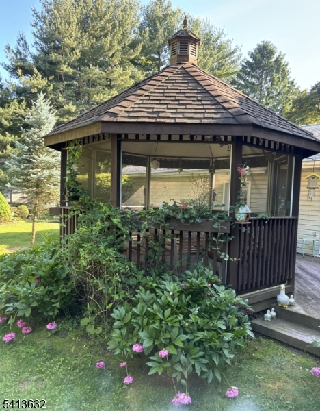 14 Ramsey Road Lebanon, NJ 08833 - Photo 39 of 47 a front view of a house with garden