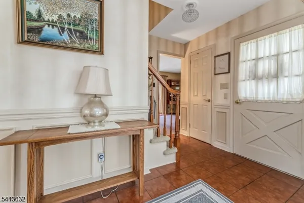a view of living room filled with furniture and wooden floor