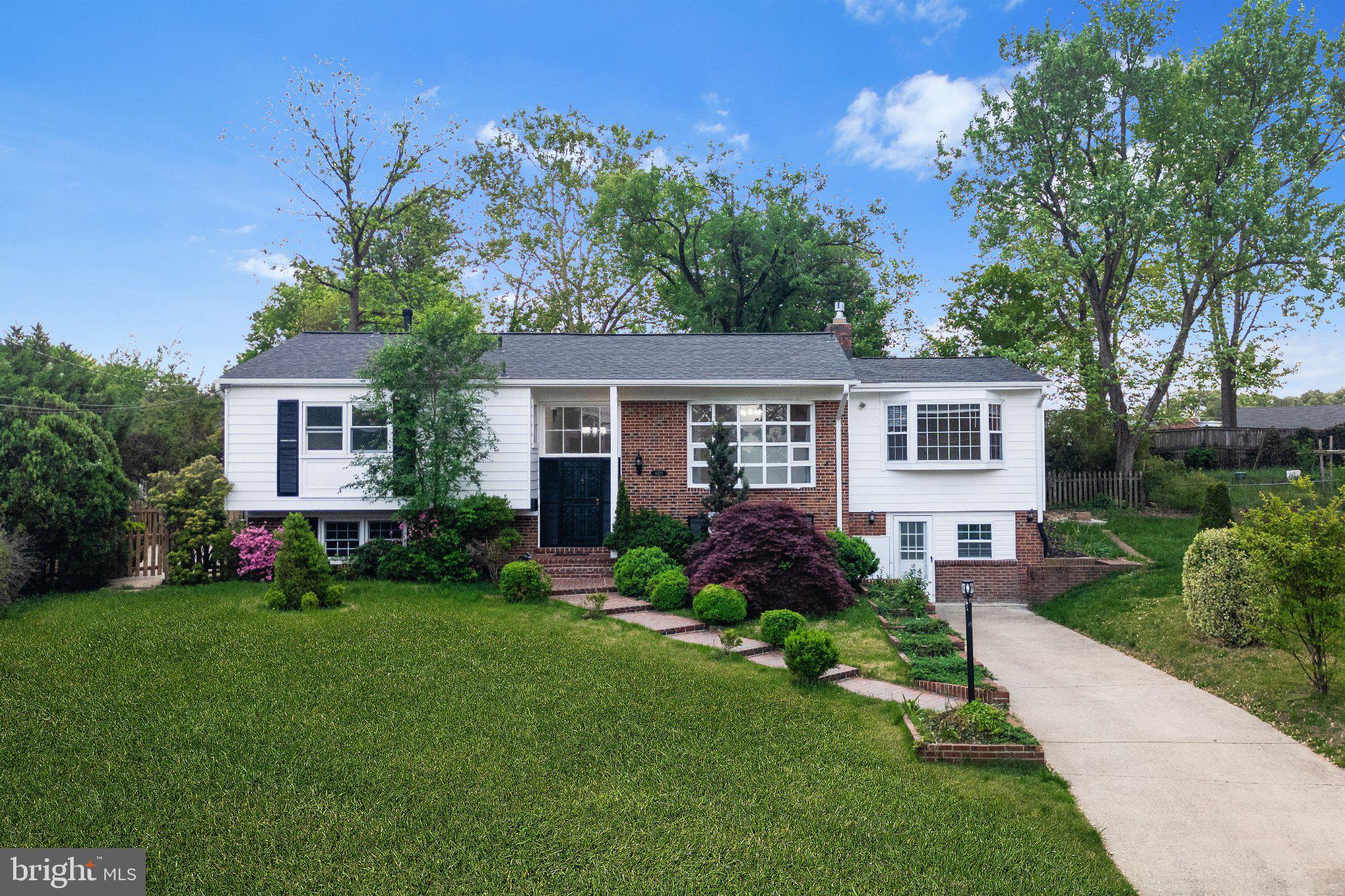 Charming home with lush greenery.
