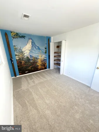 a view of a room with furniture and a gate