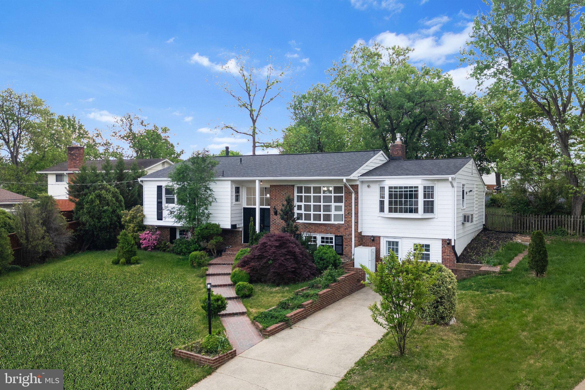 6423 Cabell Court Springfield, VA 22150 - Photo 2 of 58 Charming home with lush greenery.