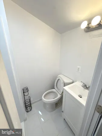 a bathroom with a toilet and a sink