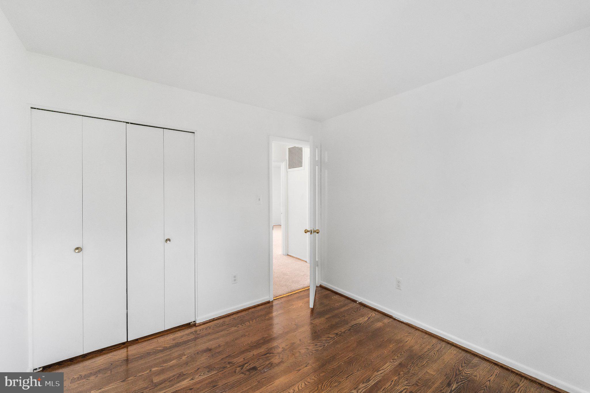 6423 Cabell Court Springfield, VA 22150 - Photo 28 of 58 a view of an empty room with wooden floor