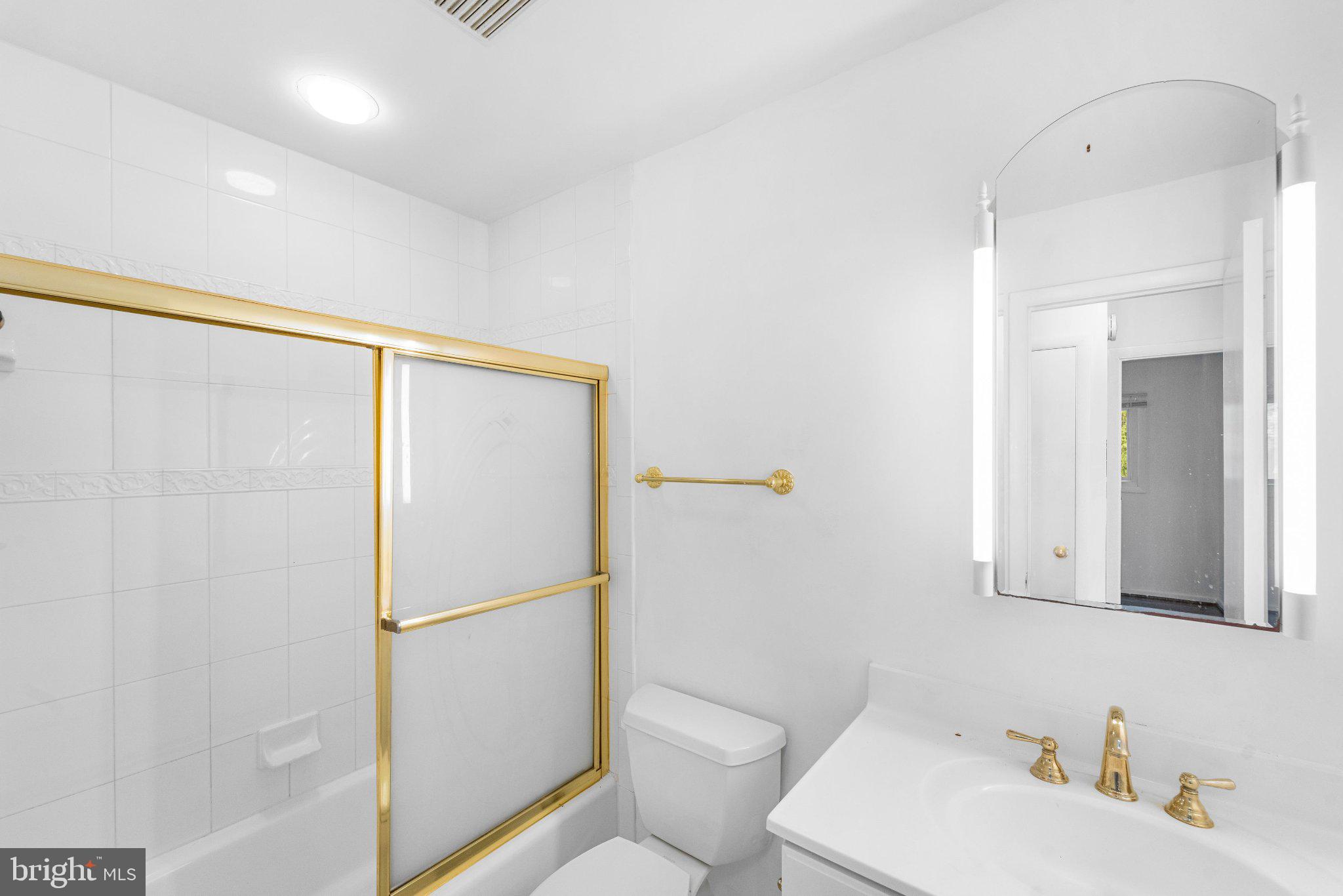 6423 Cabell Court Springfield, VA 22150 - Photo 29 of 58 a bathroom with a sink toilet and shower